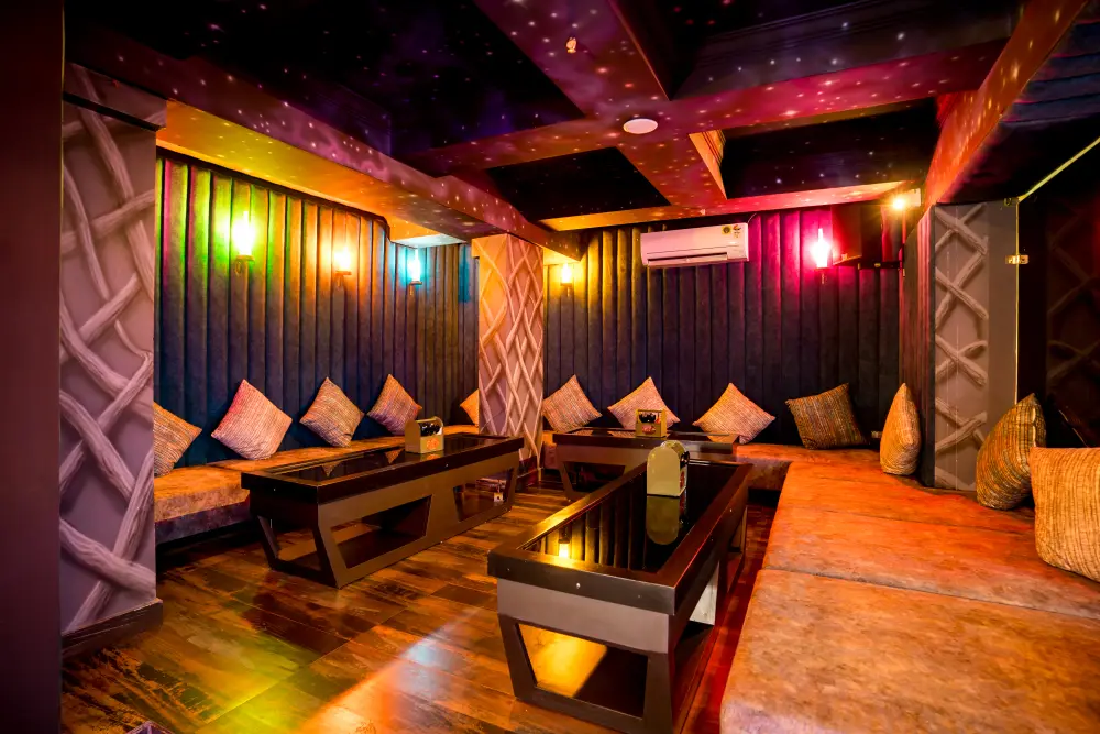 DJ performing to a packed dance floor at TOS Club & Lounge