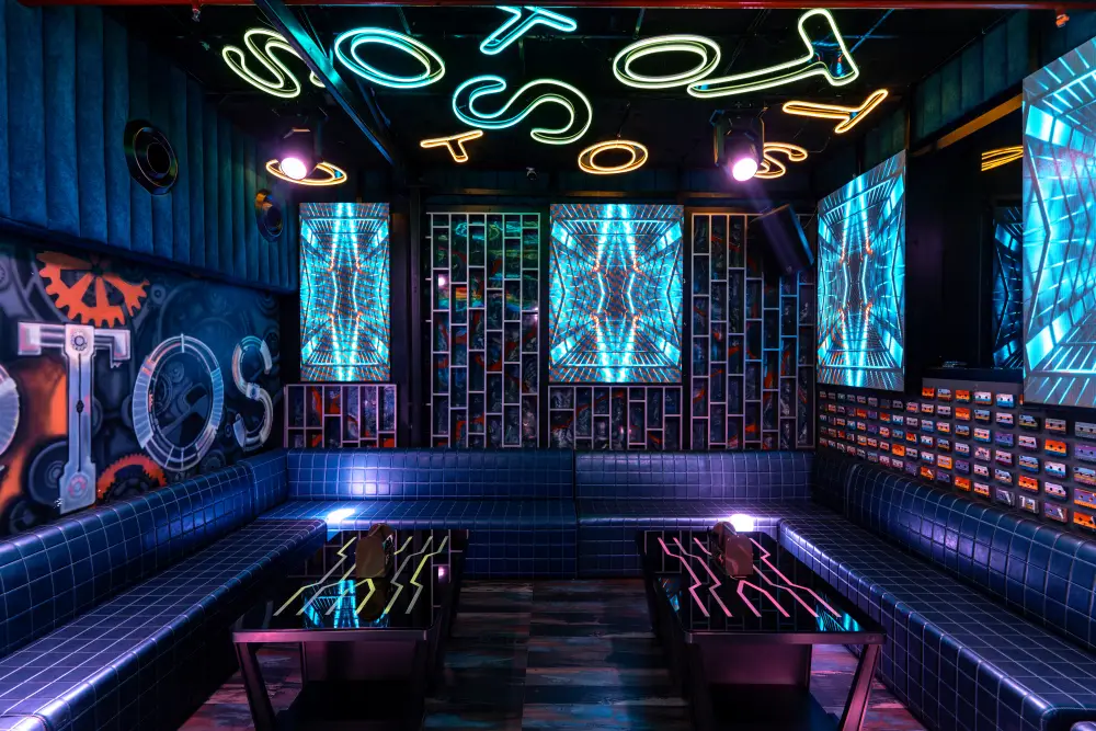 Neon-lit bar and lounge seating at TOS Club Banjara Hills, Hyderabad